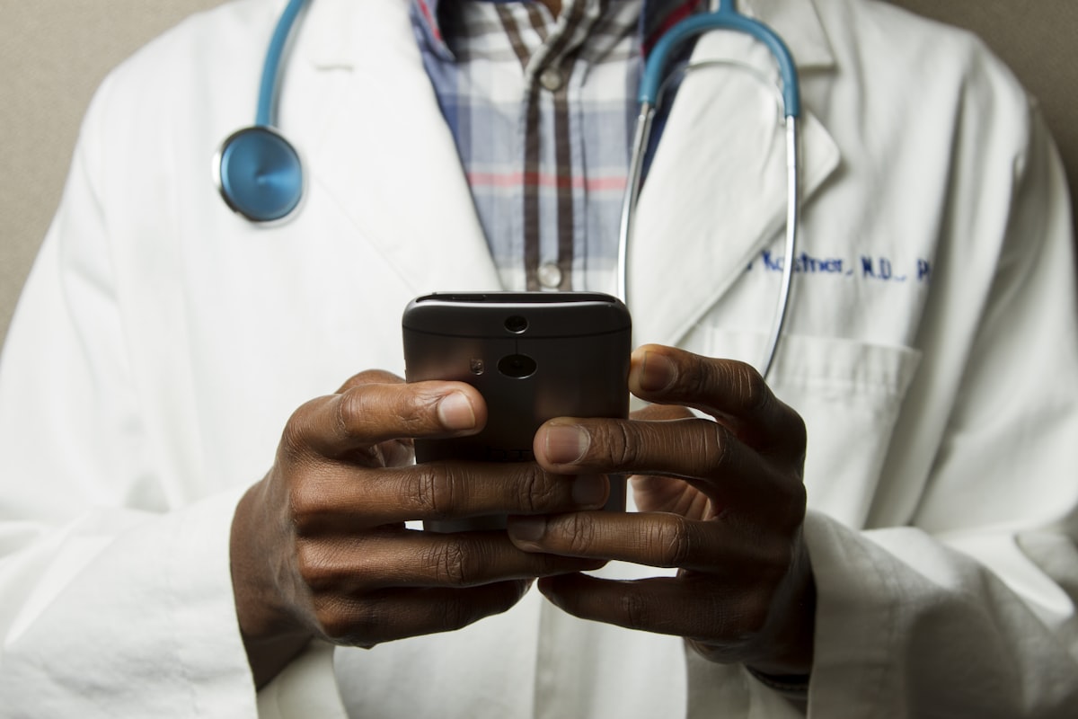 Healthcare professional using a phone